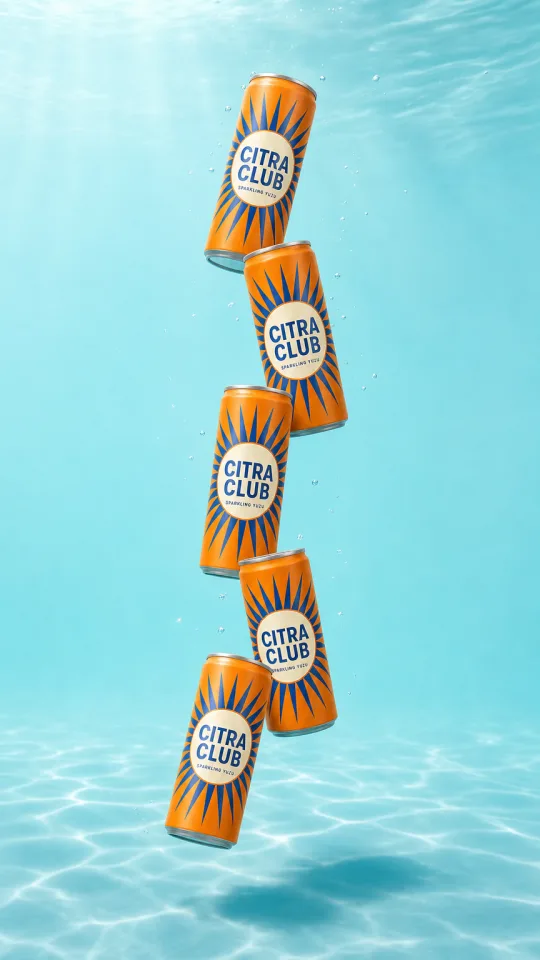Drink cans tumbling through blue water
